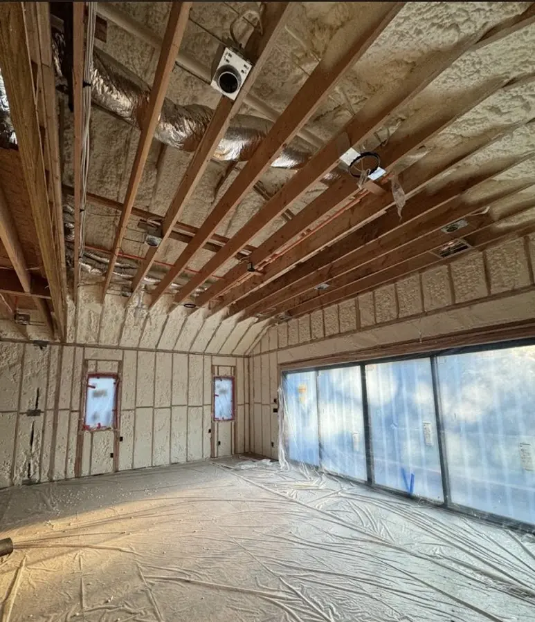 Interior walls and ceiling insulated with spray foam during new construction in Littleton
